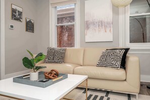 Apt 1 – Unwind on the comfortable living room couch to enjoy a movie