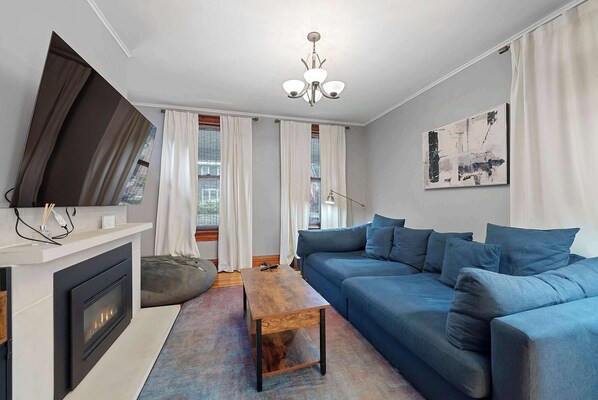 Curl up in the chic living room & stream your favorites on the smart TV