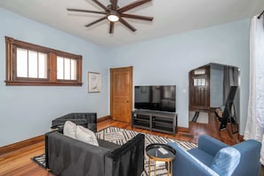 Cozy and spacious living area with TV