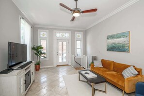Cozy and spacious living area with TV