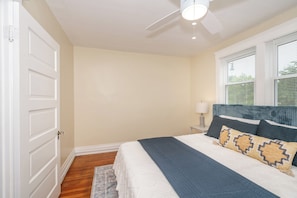 The 1st of 3 bedrooms offers a king bed & ceiling fan