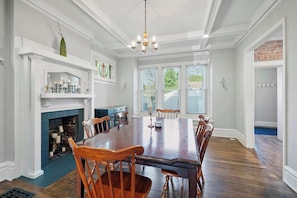 Gather for meals together in the chic dining room, offering seating for 6