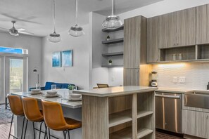 You’ll love the convenience of this fully equipped kitchen, where you can brew coffee, cook meals, or prepare snacks. The cozy layout and warm ambiance make cooking here a delightful part of your stay.