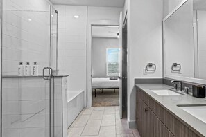 "Indulge in relaxation and rejuvenation in our full Bathroom 1. Experience luxury and comfort in every detail."