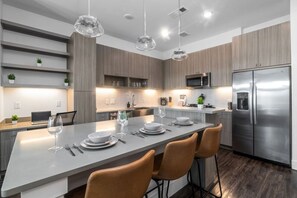You are surrounded by tasteful decor and warm tones, making the dining room a perfect setting for any occasion.