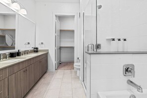 You feel a sense of calm as you enter the bathroom, where the thoughtful design and high-quality materials create a serene environment.