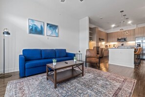 As you take a seat in the living room, the comfortable furniture and tasteful design make it easy to unwind.