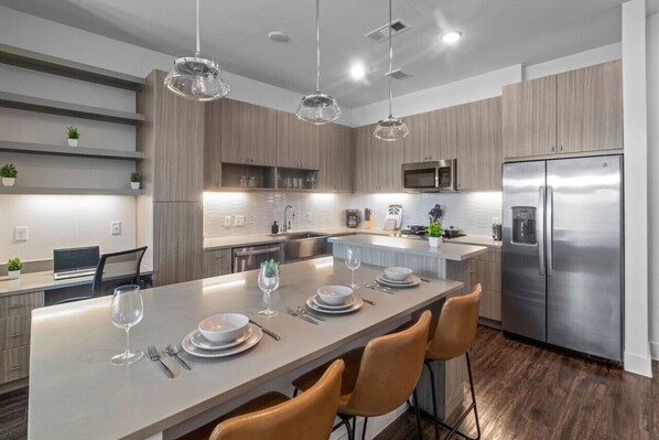 As you take your seat, the dining room's sophisticated design sets the stage for memorable meals and conversations.