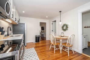 The sunny eat-in kitchen boasts plenty of space & amenities