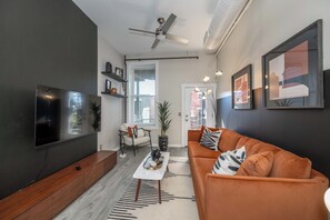 Curl up in the chic living room & stream your favorites on the smart TV