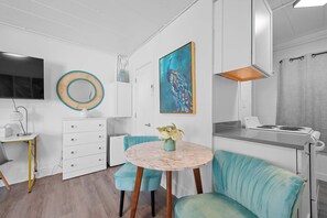 Sip coffee or an evening cocktail with your meal at the 2-seater dining table