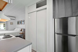 The cozy kitchen offers ample storage space & all the comforts of home