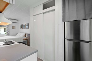 The cozy kitchen offers ample storage space & all the comforts of home