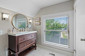 Wash up in the 2nd-floor full bath, with a single vanity & shower/tub combo
