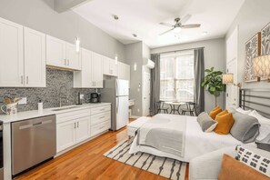 Relax with your favorite streaming in this chic studio’s plush queen-sized bed