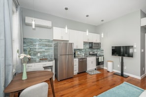 The sleek, fully equipped kitchen offers every comfort of home