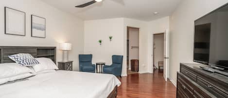 The 1st floor king suite boasts a Smart TV, walk-in closet, & private en suite
