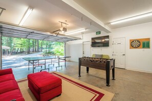 Garage - game room with TV, foosball, and table tennis