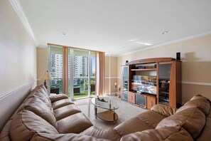 Relax in the spacious living space with a sectional sofa and TV