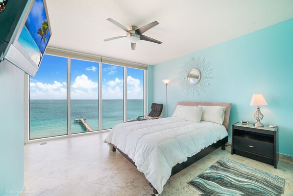 Bedroom 2 with queen bed, and balcony access
