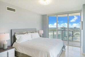 Bedroom 1 with kind bed, TV, en-suite, and a breathtaking view