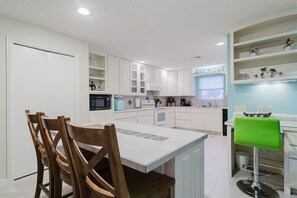 Enjoy a gourmet kitchen with island seating and all of the amenities for the chef in you