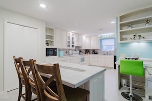 Enjoy a gourmet kitchen with island seating and all of the amenities for the chef in you
