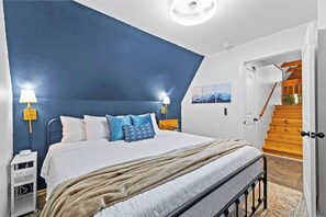 Bedroom on main level has king bed and Consumer Reports well-rated mattress/pad