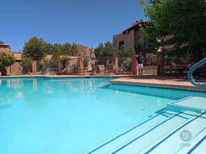 8 foot deep pool, brand new resurfacing,  that's the condo above! year round 
