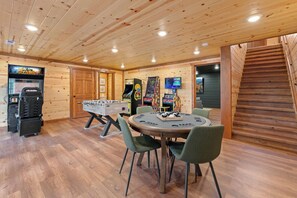 Fun-filled game room with arcades, poker table, and foosball!