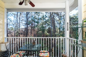Balcony with outdoor seating and lush forest view