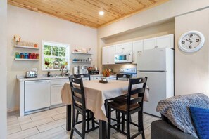 Cozy dining space paired with a fully stocked kitchen. 