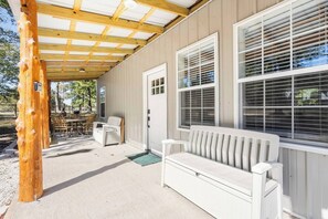 Spacious front porch featuring ample seating.