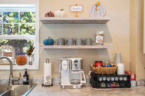 Inviting coffee station that is well stocked. 