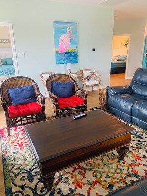 Living room has seating for nine.