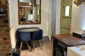 Kitchen dining room with fridge freezer and washer drier and micro wave 
