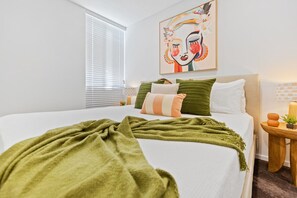 The master bedroom features a spacious king-size bed, dressed in inviting linens, and ample wardrobe space. With soft lighting and a tranquil atmosphere, it’s the perfect retreat for restful nights and rejuvenating mornings.
