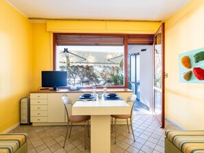 Furniture, Property, Table, Window, Building, Cabinetry, Interior Design, Plant, Yellow, Living Room
