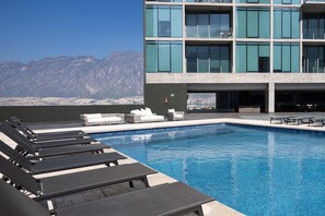 Relax poolside with breathtaking mountain views and modern architecture as your backdrop.