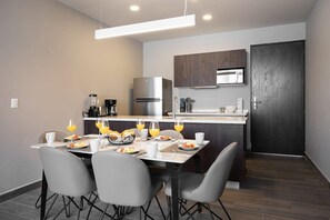 Elegant dining setup next to the modern kitchen, perfect for casual meals.