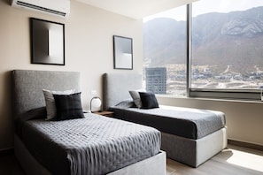 Third bedroom with two single beds, ideal for families or friends traveling together.