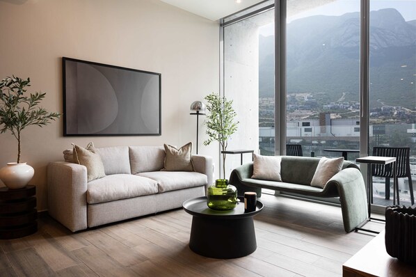Bright and stylish living room with a Smart TV and incredible mountain views.