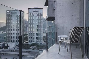 Private balcony view of the city skyline, perfect for morning coffee or evening drinks.