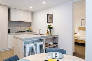Experience effortless elegance at this sleek kitchen counter, featuring a modern sink that combines style with functionality for all your culinary adventures