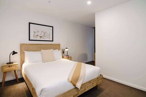 Indulge in the comfort of this queen bedroom, complete with an ensuite for your privacy and a dedicated workspace, perfect for both relaxation and productivity