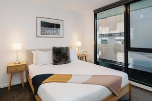 Discover serenity in this beautifully appointed queen bedroom, where comfort meets elegance