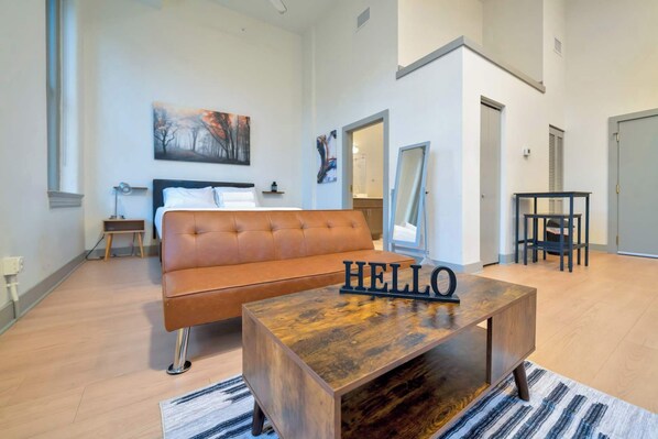 Cozy studio unit featuring a comfortable queen bed for restful nights!
