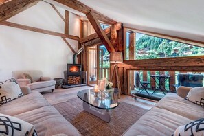 Lounge with wood burning stove and balcony