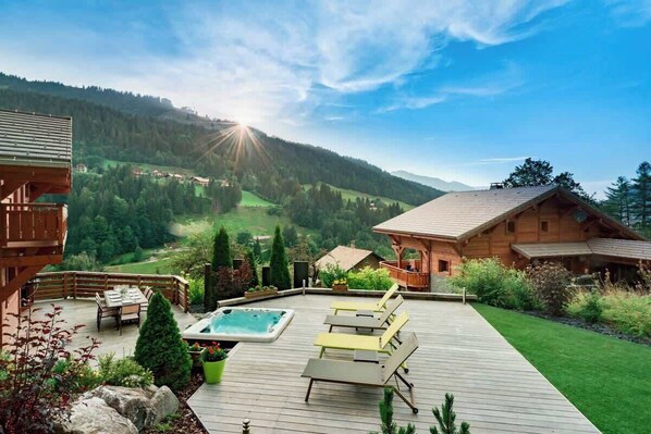 Large deck suitable for yoga and exercising. Large hot tub and spectacular views.