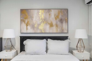 Stream your favorites on the smart TV while lounging in the plush queen bed